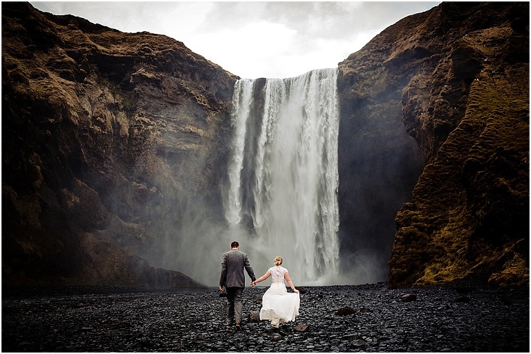 Iceland Elopement bride and groom at Skogafoss waterfall in Vik Icealnd